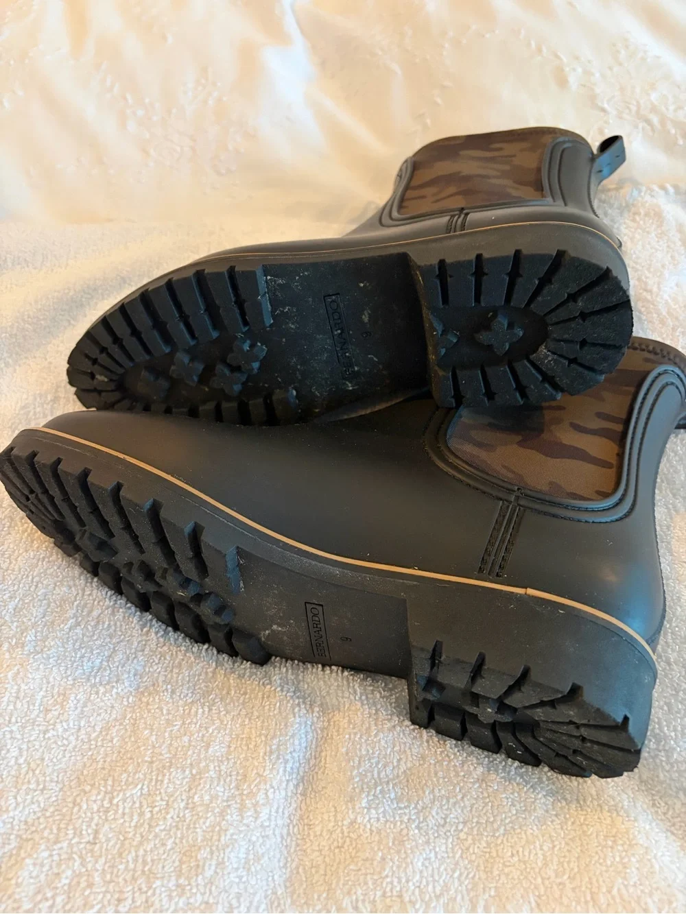 Bernardo Black Ankle Rain Boots with camo accents.